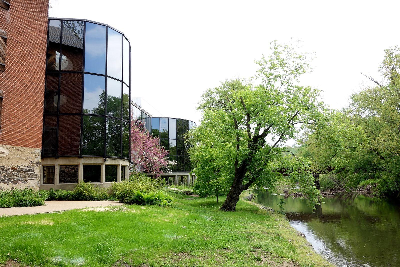 The Brandywine River Museum of Art, a brick and glass building beside the Brandywine Creek in Chadds Ford