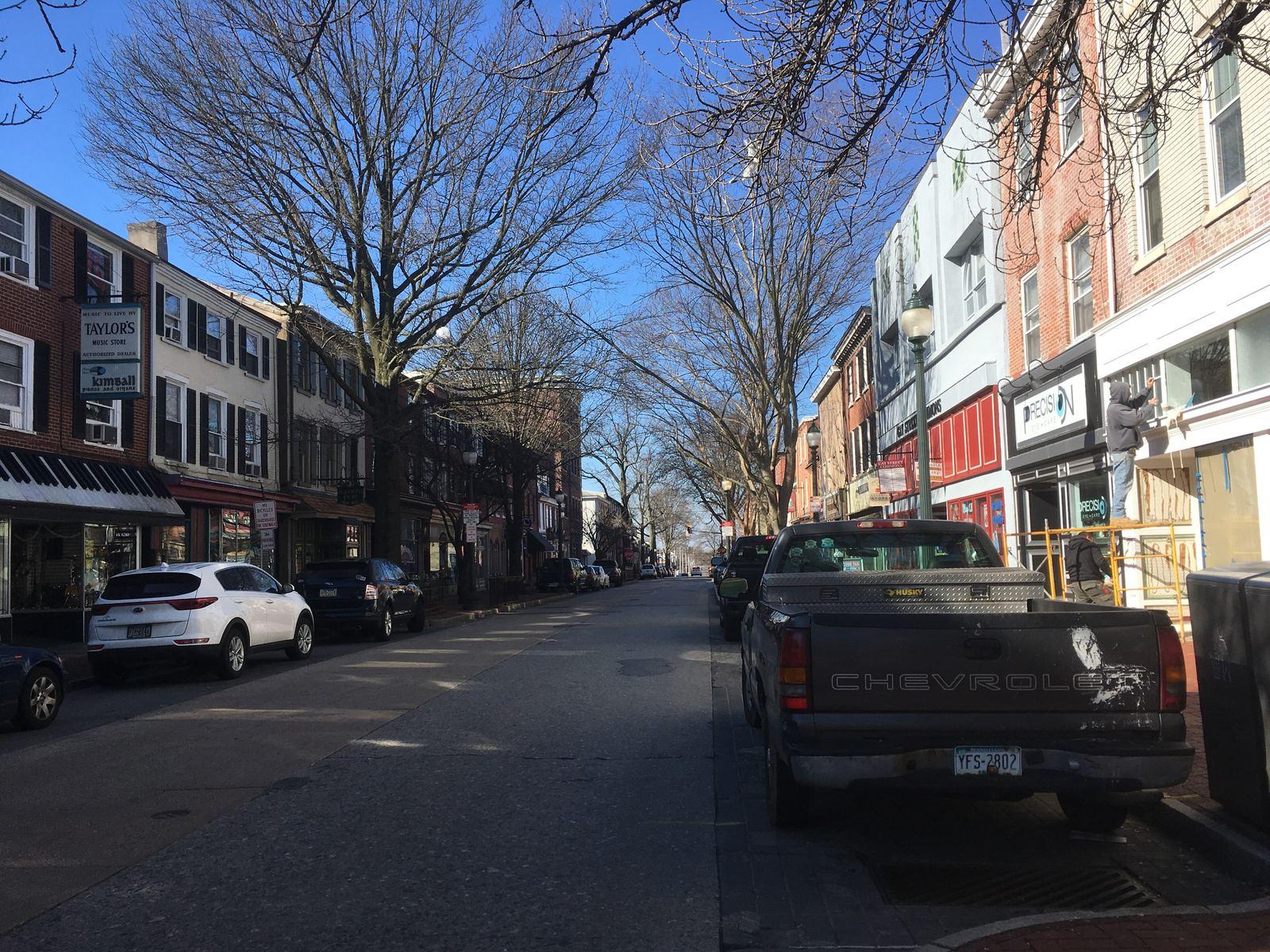 Gay Street in downtown West Chester, lined with brick storefronts and trees