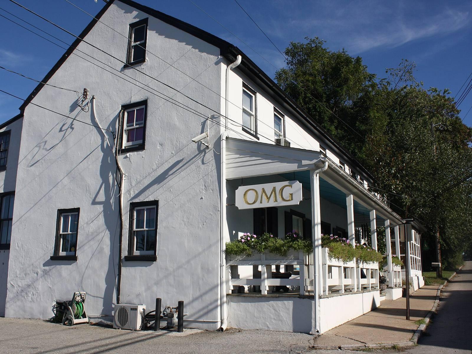 The War Office, a long stuccoed stone building from 1798 with a front porch, in the Gladwyne Historic District